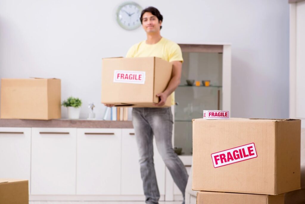 Professional movers carrying boxes in University Park, FL