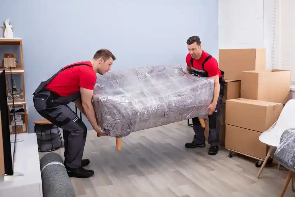Our expert moving services in University Park fl team handling furniture.