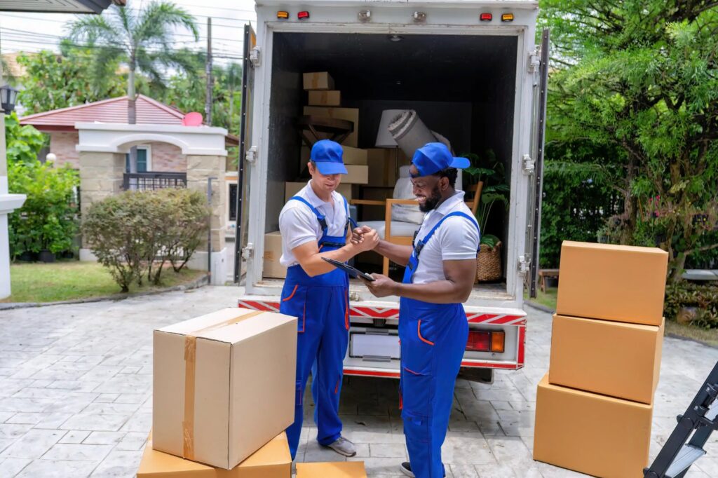 Professional movers carrying boxes in Coral Terrace, FL