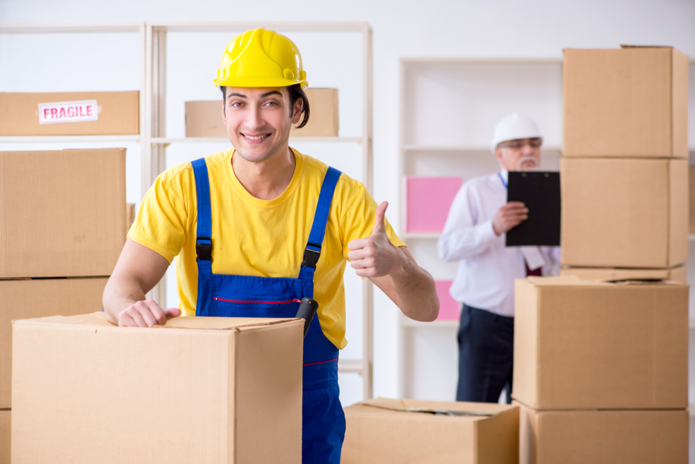 Professional movers carrying boxes in Sweetwater, FL
